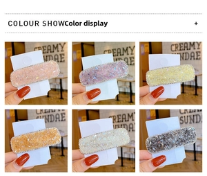 Detail showing six colorful glitter hair clips with rhinestone edges in rectangular shape