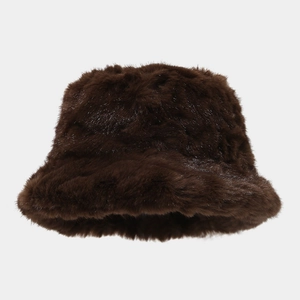 Close-up of thick dark brown faux mink fur bucket hat with soft plush texture for winter
