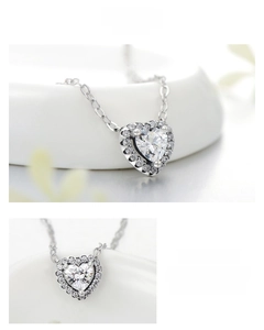 Macro detail of S925 sterling silver heart pendant necklace with shimmering zircon stones