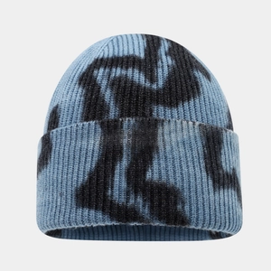Detailed close-up of blue and black tie-dye knit beanie showing ribbed wool texture