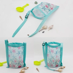 Detail of kids mesh beach bag with starfish print and adjustable blue strap