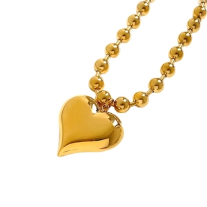 Polished gold stainless steel heart pendant necklace with elegant beaded chain jewelry
