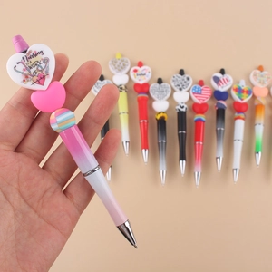 Creative pink gradient beadable pen with Nursing Is A Work Of Heart charm and beads