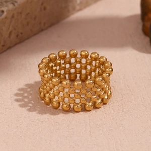 Golden mesh link ring with beaded texture made of 18K gold plated stainless steel