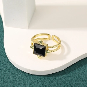 Vintage style gold adjustable ring featuring a square black gemstone with ornate cross detail