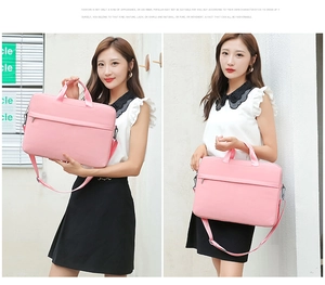 Pink minimalist laptop bag with shoulder strap shown in hand and crossbody styles