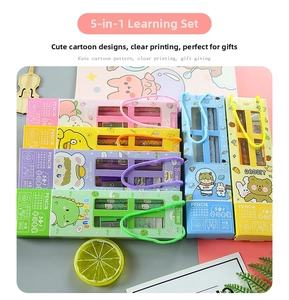 Flat lay of a 5-in-1 cartoon stationery set including pencils and a sharpener