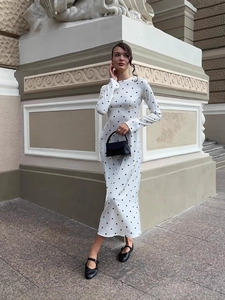 Elegant white polka dot long sleeve maxi dress with a slim waist and classic round neck