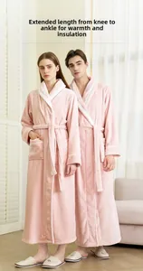 Detailed view of plush coral fleece couple robes with waist belts and large lapels