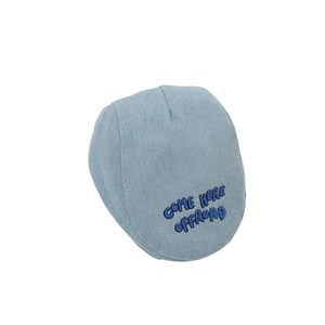Light blue denim baby flat cap with dark blue Come Here Offroad embroidery detail