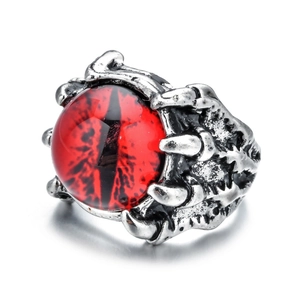 Detailed macro view of the punk eagle claw ring featuring a striking red evil eye center