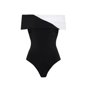 Detail of the chic black and white color block V-neck design on this one-piece swimsuit
