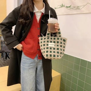 Detail of green and white checkerboard waffle fleece tote bag with LOVE SOZAKKA patch label