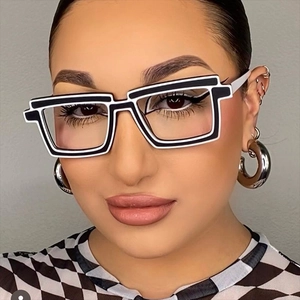 Macro shot of 2D cartoon style square TR90 glasses frames with black and white bold lines