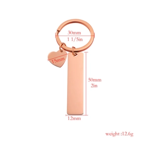 Rose gold stainless steel keychain with heart and rectangle charms shown with dimensions