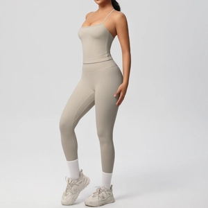 Close-up of seamless beige high-waist yoga leggings and sports bra with a slim fit profile
