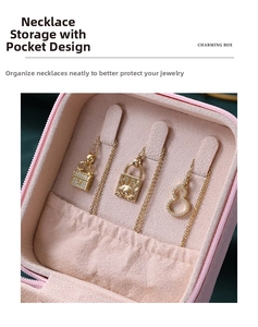 Pink jewelry box detail showing necklace hooks and elastic pocket for tangle-free storage