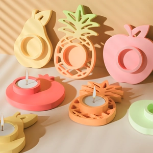 Creative fruit-shaped candle holders in matte silicone for DIY crafts and home decor