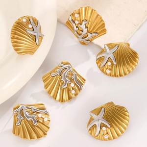 Golden scallop shell earrings with pearl, starfish and coral charms in ocean style