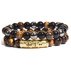 Close-up of tiger eye and black agate beads with gold pavé crystal metal tube