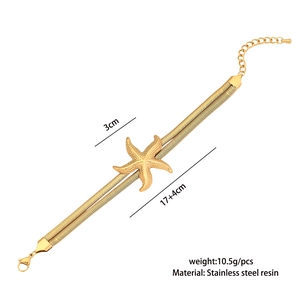Macro shot of 17+4cm gold starfish bracelet showing stainless steel chain details