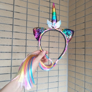 Close-up of unicorn headband with colorful wig ponytail and sequins for themed parties