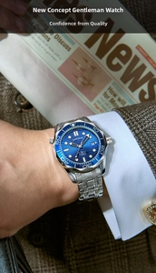 Close-up of men's quartz watch with blue wave dial and silver stainless steel strap