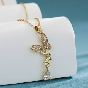 Elegant gold butterfly pendant necklace with zircon tassel and teardrop crystal charm
