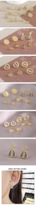 Close-up of religious Virgin Mary stud earrings with zircon inlay and gold finish