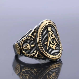 Macro detail of vintage Freemasonry ring with gold accents and engraved G symbol