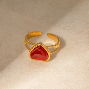 Detail of 18k gold stainless steel open ring with heart-shaped red agate inlay