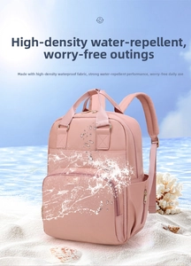 Pink high-density water-resistant backpack showing strong water repellent fabric performance