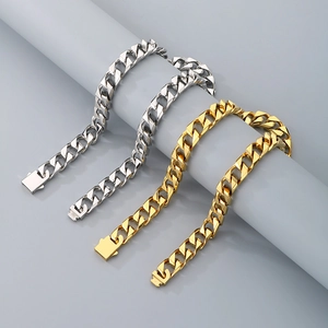 Macro detail of gold and silver cuban link chains with classic square plug buckle
