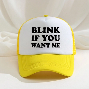 Yellow and white trucker hat with Blink If You Want Me text print on the front
