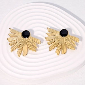 Elegant gold fan-shaped stud earrings with black center beads on a white tray