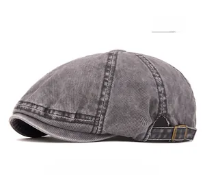 Close-up of vintage washed denim newsboy cap with antique bronze adjustable side buckle