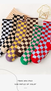 Close-up of colorful checkered knit crew socks in diverse vibrant color combinations
