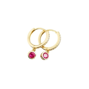 Close-up of gold hoop earrings with white zircon stones and round pink gemstone charms