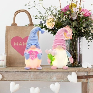 Luminous Mother's Day faceless gnomes with Best Mom Ever signs in cozy spring setting