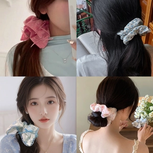 Lace hair scrunchies in various floral patterns shown on hair for versatile styling
