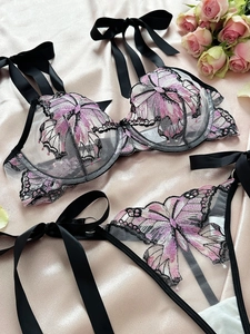 Detailed butterfly embroidery on mesh lingerie set with black satin bow accents