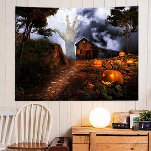 Halloween tapestry with mysterious hand and glowing pumpkins on white wooden wall background