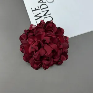 Detail of 10cm burgundy multi-layer handmade fabric flower brooch with realistic petal texture