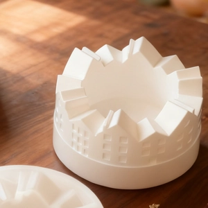 Detailed macro view of white silicone mold featuring micro house and town architectural patterns