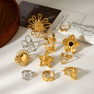 Minimalist stainless steel ring set featuring floral heart and star designs in gold and silver