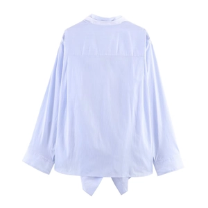 Back view of light blue striped batwing sleeve blouse with stylish knotted hem detail