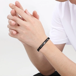 Men's black stainless steel bracelet with Roman numerals on a curved plate model view