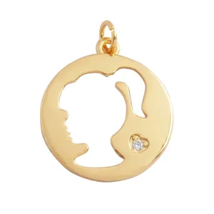 Detail of 20mm gold-plated cutout pendant featuring a female profile silhouette
