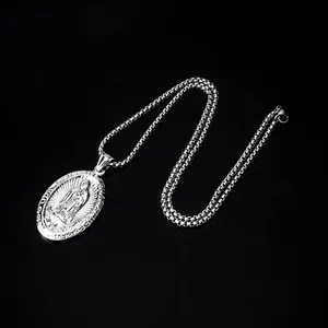 Detailed close-up of oval Virgin Mary pendant with 3mm stainless steel curb chain