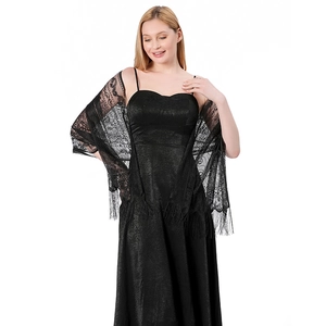 Close-up of black floral lace shawl featuring hollow-out patterns and long fringe tassels